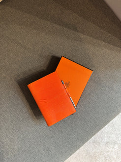 Hermès Index in Orange Lizard Leather